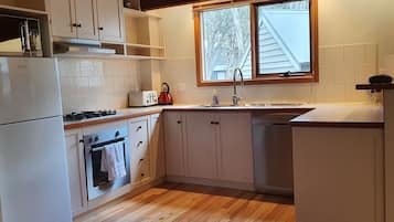 Deluxe Apartment, 4 Bedrooms, Fireplace, Mountainside | Private kitchen | Full-sized fridge, microwave, oven, stovetop