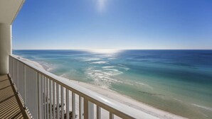 A balcony with a view of a beach and ocean. - Ocean Ritz by iTrip Panama City Beach (Panama City Beach)