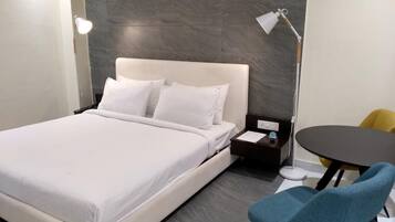Executive Room | Memory-foam beds, individually decorated, individually furnished, desk