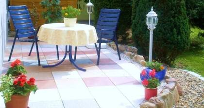 Cosy apartment with a terrace in a quiet location with many forests and lakes