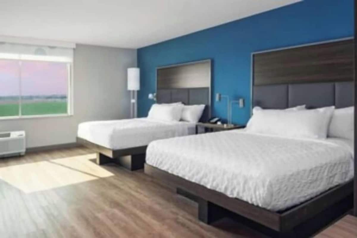 Premium bedding, pillow-top beds, desk, laptop workspace