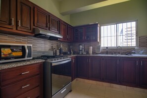 Fridge, microwave, oven, stovetop - Harmony 3BR Apartment in the Heart of Piantini Nightlife  (Santo Domingo)