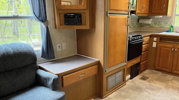 Fridge, microwave, stovetop, coffee/tea maker