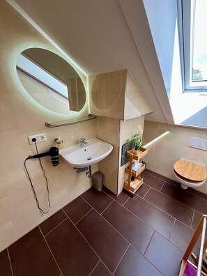 Shower, hair dryer, towels, soap