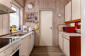Fridge, stovetop, dishwasher, coffee/tea maker