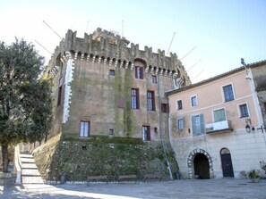 A historic building with a stone facade, arched windows, and a small balcony. - L'Amiral by Interhome (Cagnes-sur-Mer)