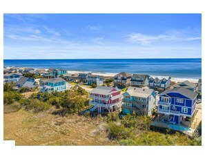 A coastal residential area with houses near the beach.
