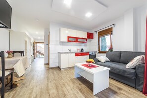 Design Apartment (A3) | Living area | 104-cm LCD TV with digital channels, TV, toys - Luxury Apartments Iva (Vodice)
