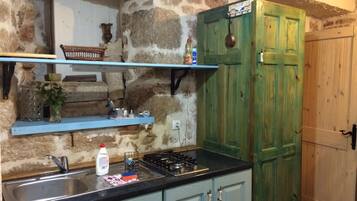 Fridge, dishwasher, coffee/tea maker, cookware/dishes/utensils