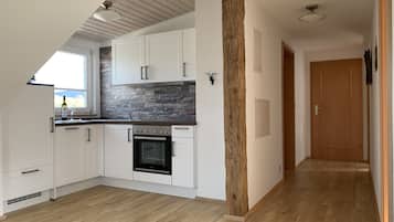 Fridge, stovetop, dishwasher, coffee/tea maker