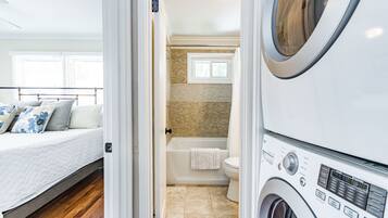 Combined shower/tub, hair dryer, towels, soap