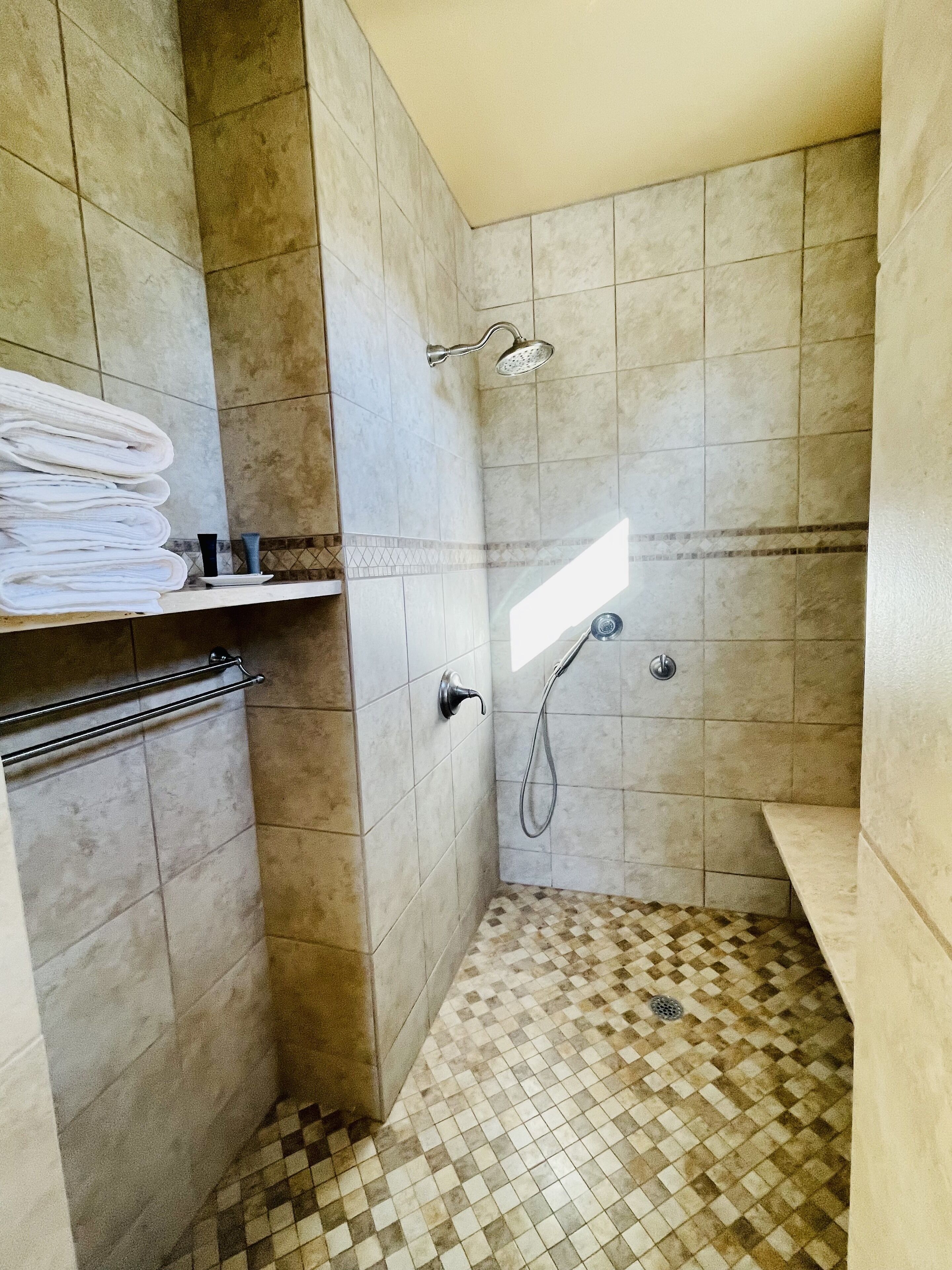 Towels right at your fingertips in the very large shower.
