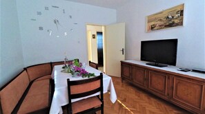 Enjoy a romantic dinner for two in this beautifully appointed dining area, complete with a wine bottle and glasses.