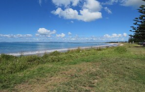 A beach with a clear sky and the text "Tokeraub Beach" visible.