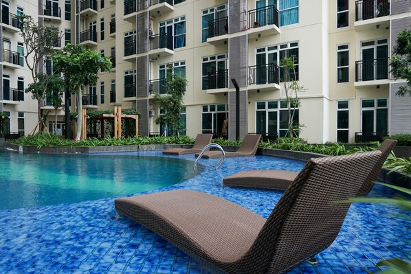 Outdoor pool - Good Location @ Studio Puri Orchard Apartment (Jakarta)