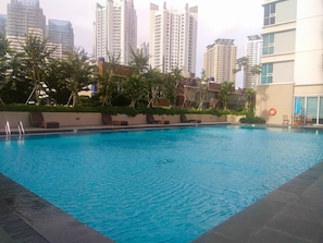 Outdoor pool - Modern 3BR Apartment at Springhill Terrace Residence (Jakarta)