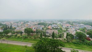 A residential area with houses, roads, and greenery. - Cozy 2BR Bogorienze Resort Apartment near Nirwana Residence (Bogor)