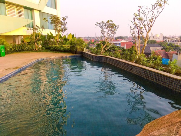 Outdoor pool - Pleasant and Modern 2BR Grand Kamala Lagoon Apartment (Bekasi)