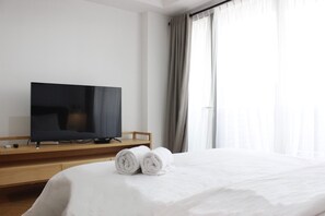 Bed sheets - Comfy & Artsy Studio at Beverly Dago Apartment (Bandung)