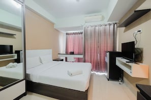Room | Desk, free WiFi, bed sheets - Simply Furnished Studio @ Grand Dhika City Apartment (Bekasi)