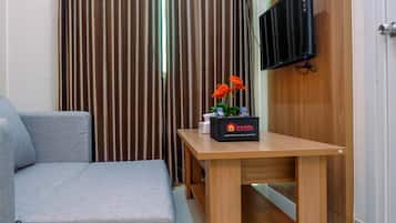 Habitación | Área de sala de estar | Televisión