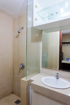 Room | Bathroom | Shower, towels - Modern Comfy Studio Apartment at U Residence (Curug)