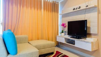 Quarto | Área de estar | TV