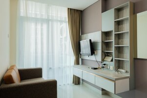 Quarto | Área de estar | TV