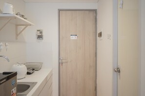 Room | Bathroom | Shower, towels - Stylish Studio Room at Akasa Pure Living BSD Apartment By Travelio (South Tangerang)