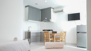 Room | Living area | TV - Chic Brooklyn Alam Sutera Studio Apartment By Travelio (South Tangerang)