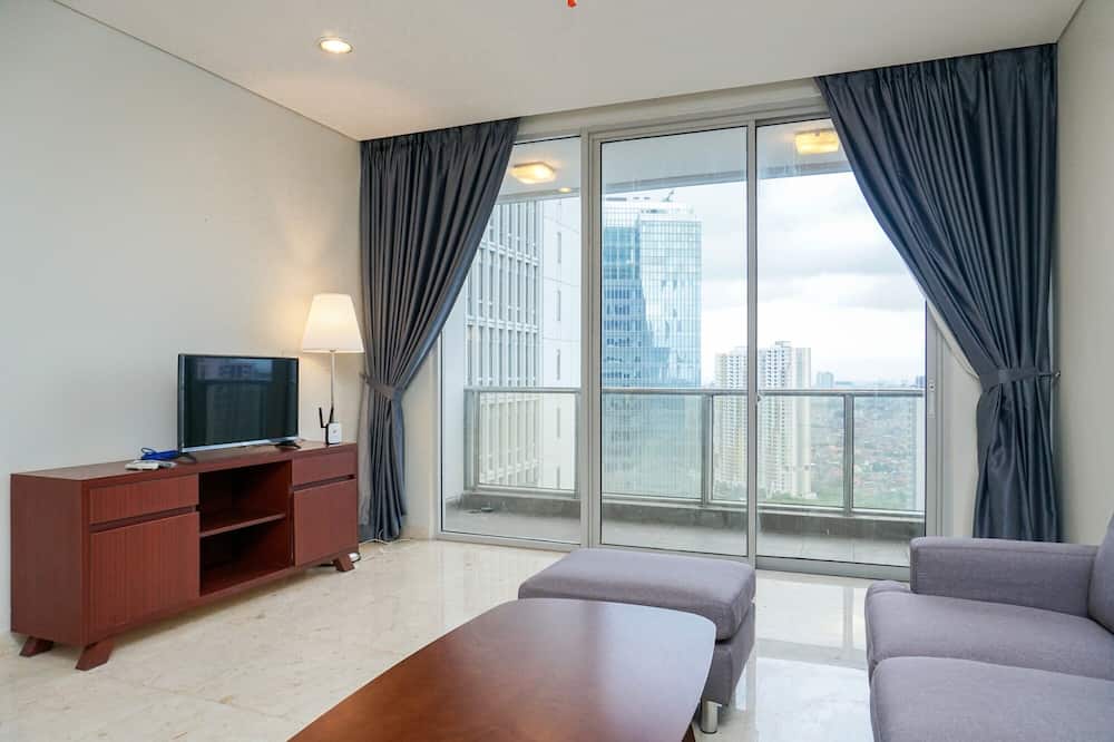 Cozy 2BR at Empyreal Epicentrum Apartment By Travelio