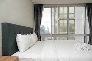 Room | 2 bedrooms, free WiFi, bed sheets - Cozy 2BR at Empyreal Epicentrum Apartment By Travelio (Jakarta)