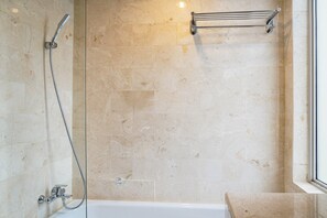 Room | Bathroom | Shower, towels, toilet paper - Cozy 2BR at Empyreal Epicentrum Apartment By Travelio (Jakarta)
