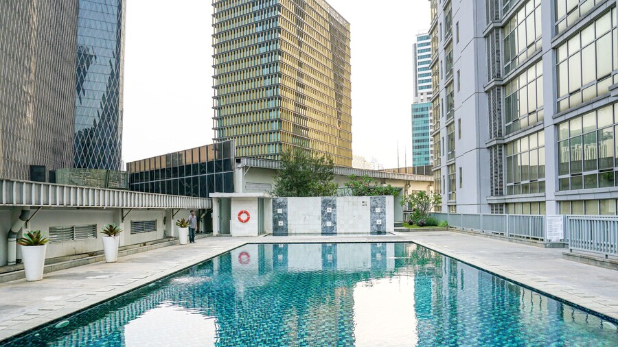 Comfy and Spacious 2BR The Masterpiece Epicentrum Apartment By Travelio