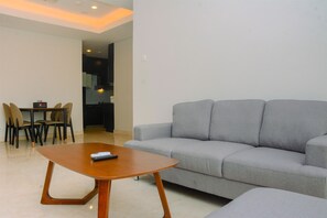 Room | Living room | TV - Comfy and Spacious 2BR The Masterpiece Epicentrum Apartment By Travelio (Jakarta)