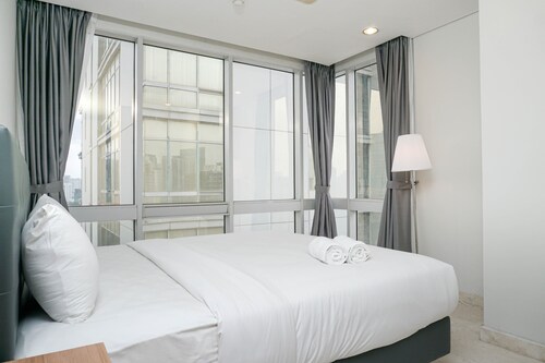 Comfortable Deluxe 2BR at The Empyreal Condominium Epicentrum Apartment By Travelio