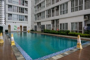 Outdoor pool - Cozy Minimalist Studio @ Taman Melati Margonda Apartment By Travelio (Depok)