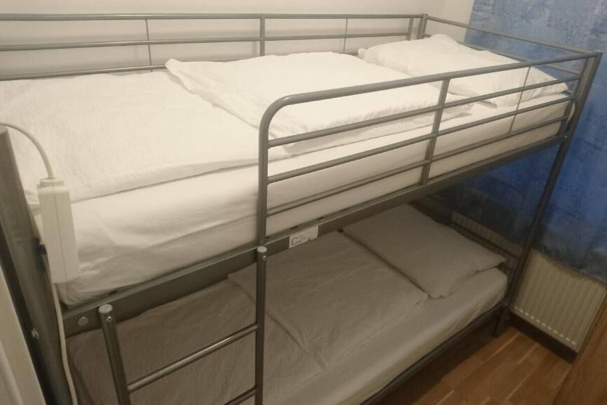 Basic Twin Room, Shared Bathroom | Hypo-allergenic bedding available, down comforters, blackout drapes