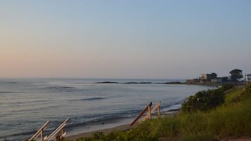 Enjoy breathtaking views of the ocean and surrounding greenery from this serene beachside location.