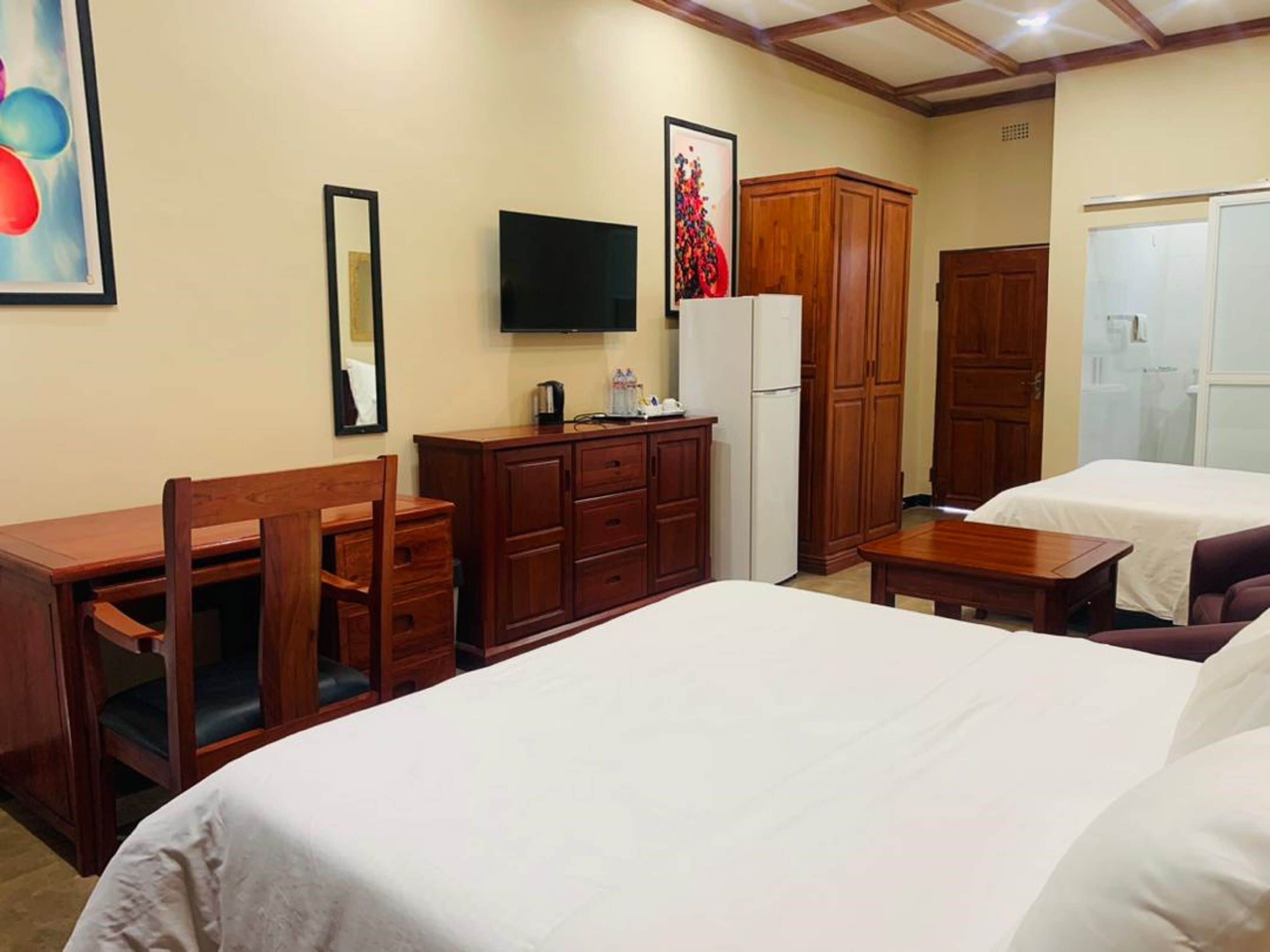 Chambre Exécutive avec lits jumeaux | Minibar, décoration personnalisée, ameublement personnalisé, bureau