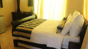 Deluxe Double Room | Premium bedding, desk, laptop workspace, blackout curtains