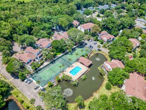 Enjoy a tennis court and serene surroundings in this residential area.