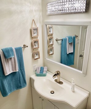 Bathtub, hair dryer, towels, soap