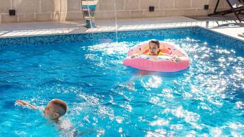 Outdoor pool, open 10:00 AM to 8:00 PM, sun loungers
