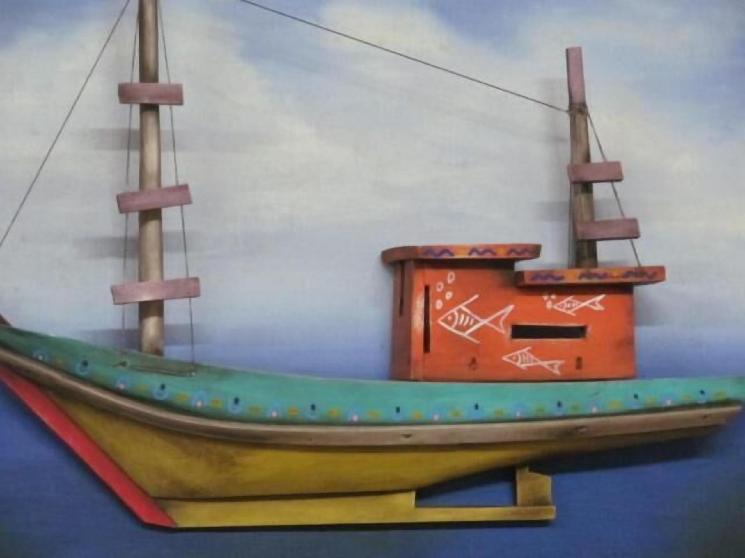 A model ship with a cabin, masts, and a rudder.