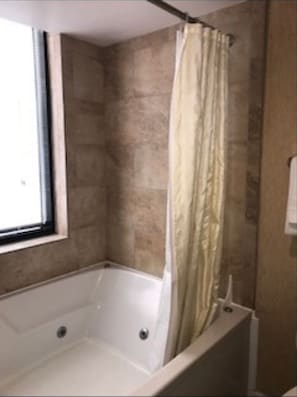 Shower, jetted bath, soap, toilet paper