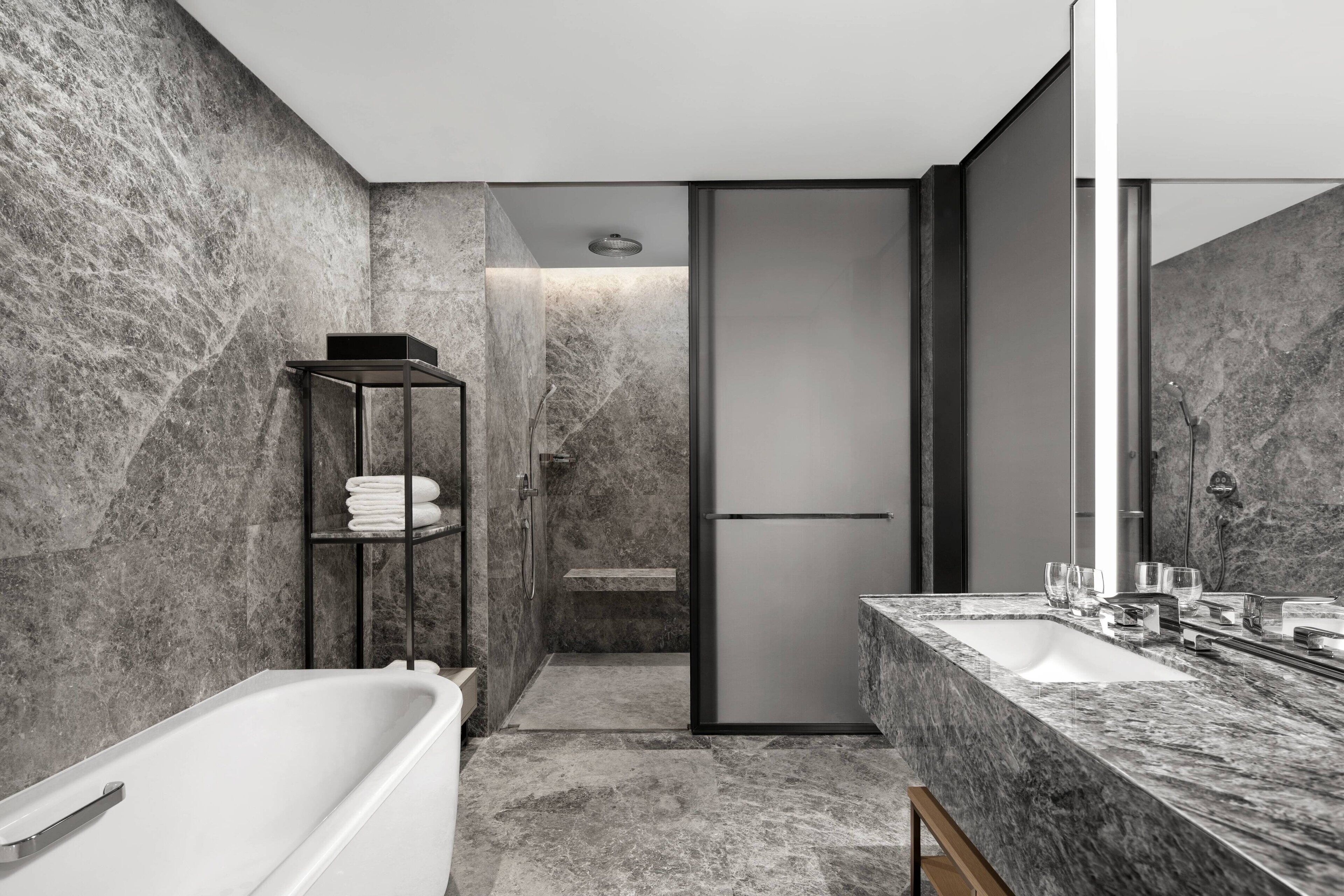 separate bathtub and shower, rainfall showerhead, designer toiletries