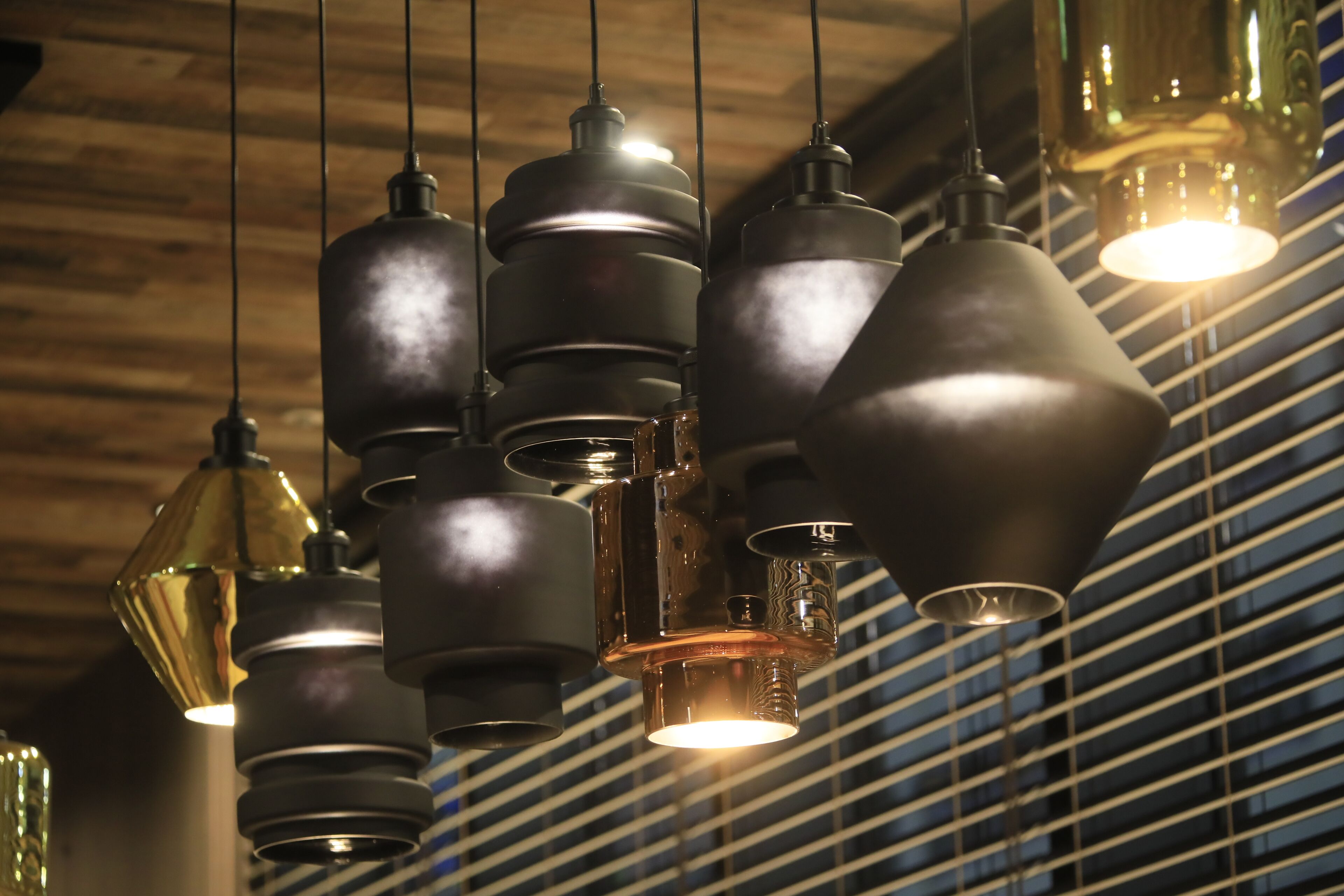 A ceiling with multiple hanging pendant lights.