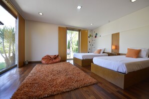 A modern bedroom with two beds, a large window, and a view of palm trees. - Villa 320 Holiday Villa w/Pool, Jacuzzi and Tennis (Barcelos)