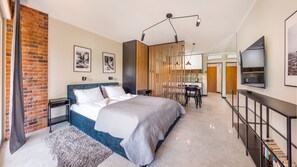 Studio (19A , ul. Szmaragdowa 21) | Living area | Flat-screen TV